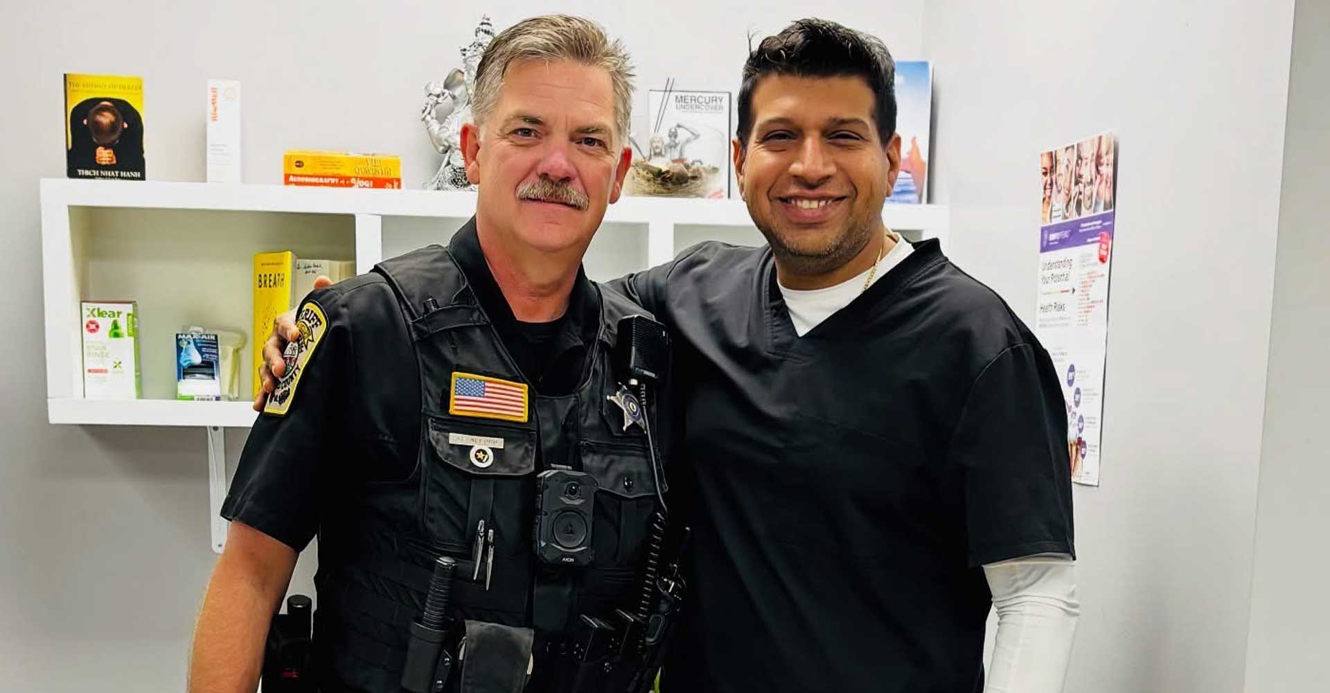 Dr. Sachin Karande with a police officer