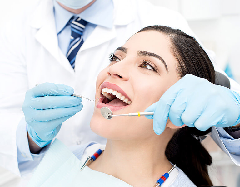 A smiling woman ate a dental clinic